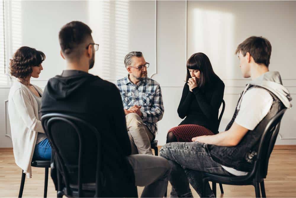 Emotional group therapy session during Alcohol Detox in Orange County focused on peer support and healing.