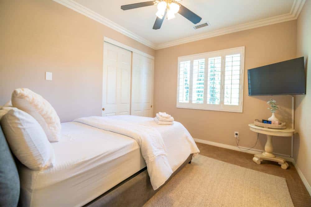Bright private bedroom for clients undergoing cocaine rehab in Orange County.