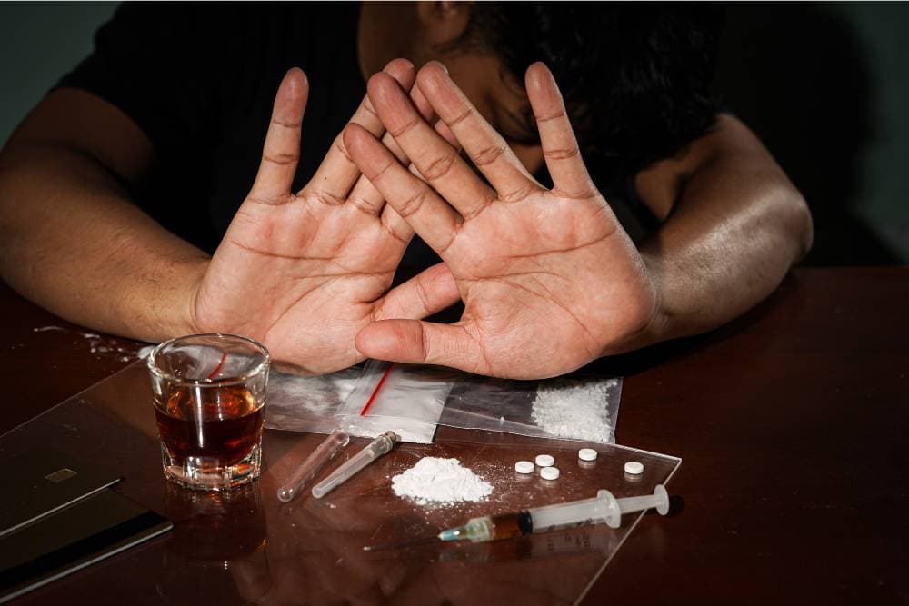 Person rejecting drugs and alcohol while in cocaine rehab Orange County program.